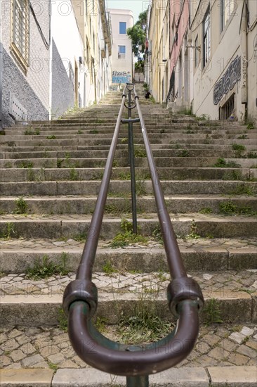 Metal railing and stone steps