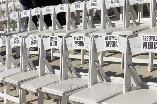 Rows of VIP chairs set up for media