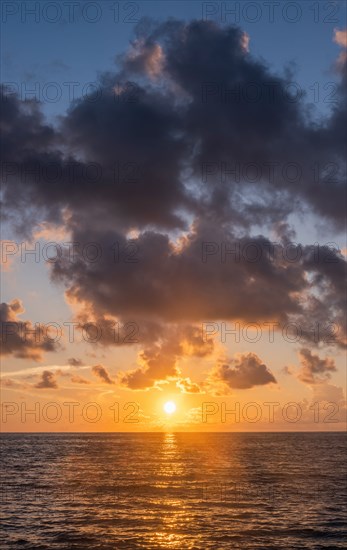 Dramatic sunrise sky above ocean