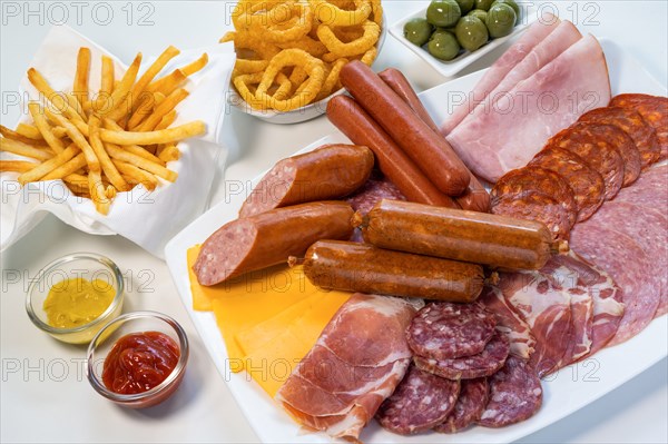 Assorted unhealthy processed and fried foods on table