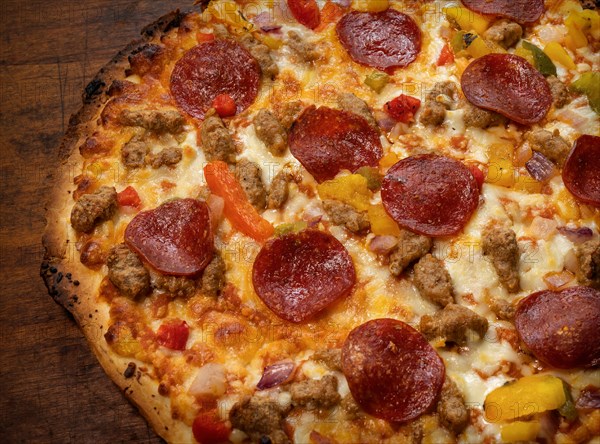 Close-up of pizza on wooden table