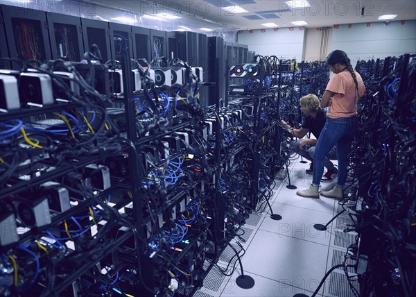 Technicians working in server room
