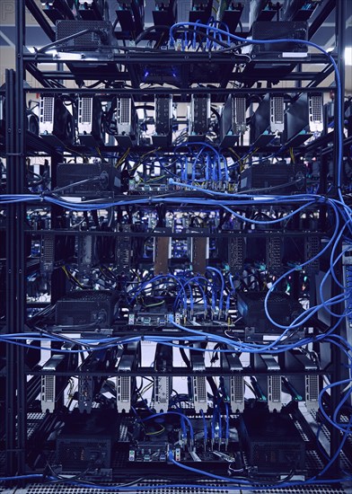 Close-up of computer cables and hard drives in server room