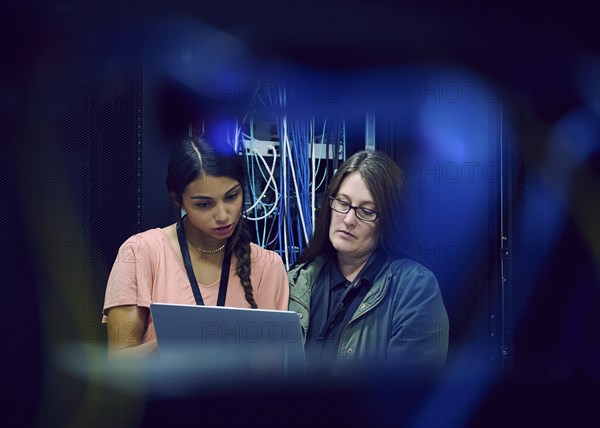 Female technicians working in server room