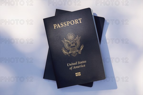Two American passports on white background