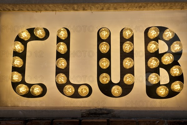 Close-up of illuminated club sign