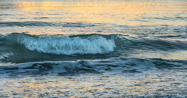 Ocean waves at sunset