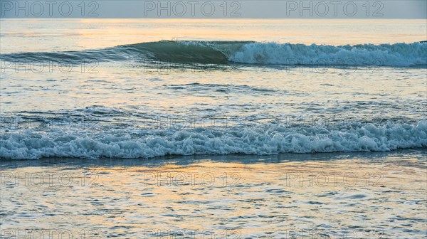 Ocean waves at sunset