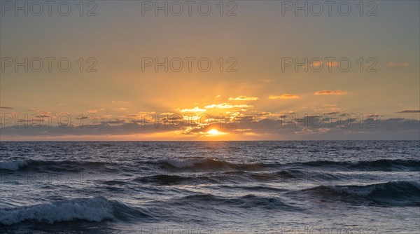 Ocean waves at sunset