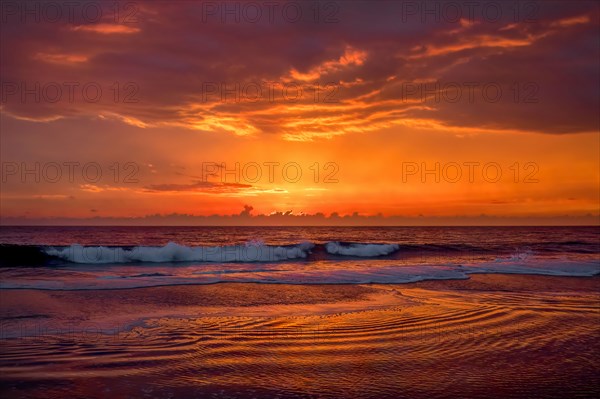 Dramatic sunset sky above ocean