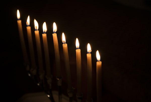 Row of candles against black background