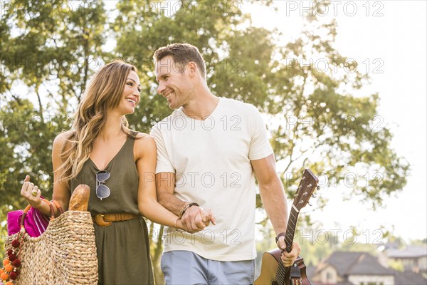 Romantic couple going for picnic on sunny day