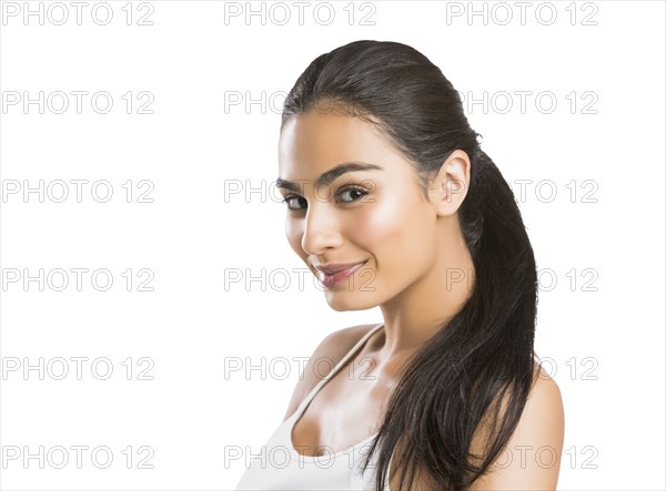 Portrait of young woman looking at camera