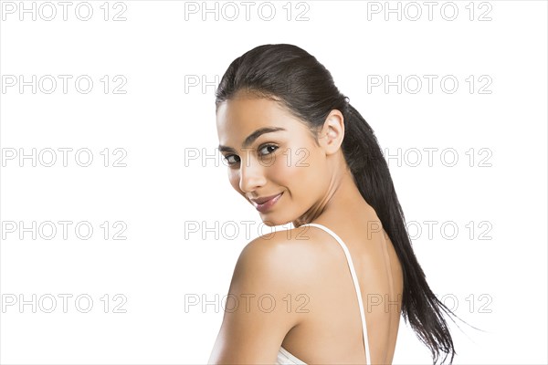 Portrait of young woman looking at camera