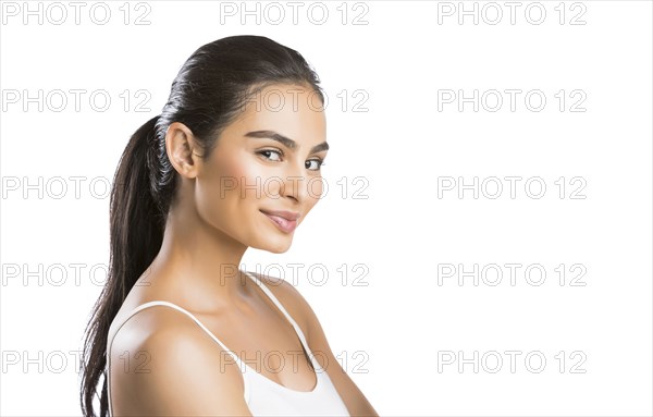 Portrait of young woman looking at camera