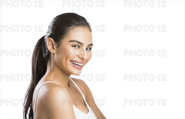 Portrait of smiling young woman looking at camera