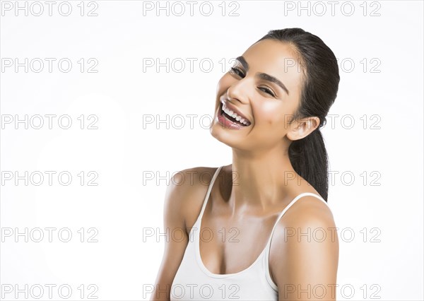 Portrait of smiling young woman looking at camera