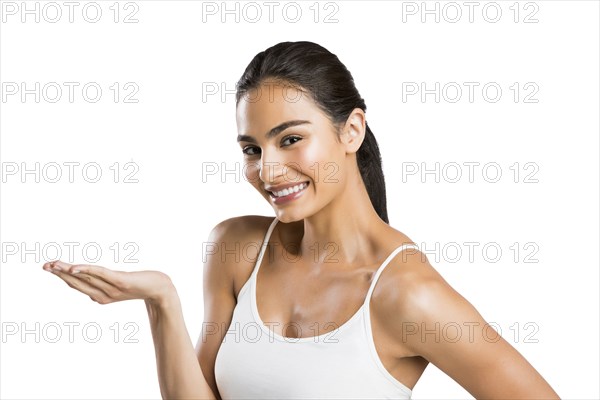 Portrait of smiling woman with cupped hand