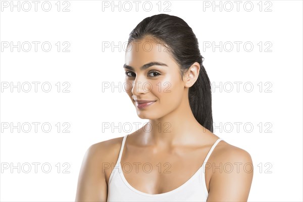 Portrait of confident young woman looking at camera