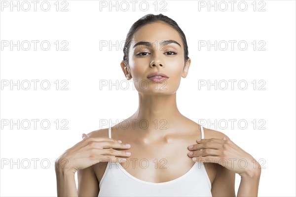 Portrait of serious young woman looking at camera