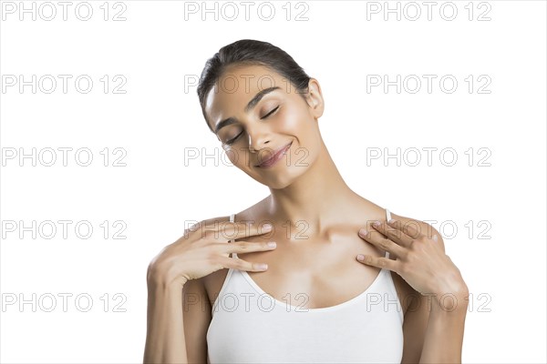 Portrait of smiling young woman with closed eyes