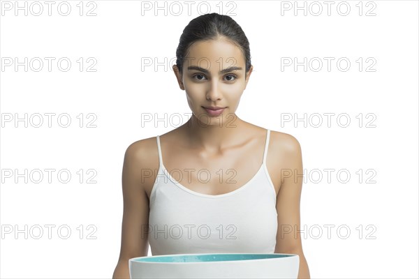 Portrait of serious young woman looking at camera