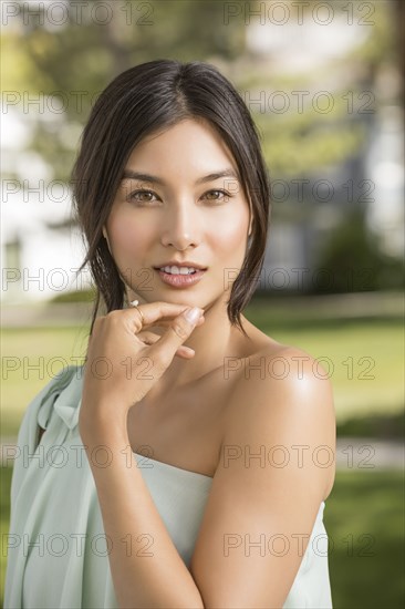 Portrait of beautiful woman looking at camera in park