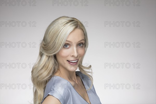 Studio portrait of beautiful blond woman