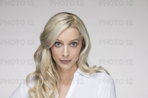 Studio portrait of beautiful blond woman