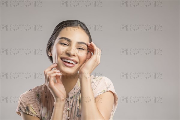 Studio portrait of happy beautiful woman