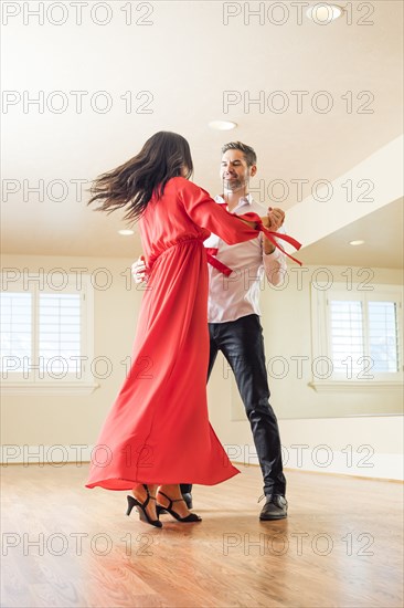 Couple dancing in dance studio