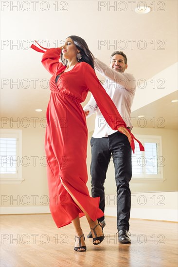 Couple dancing in dance studio