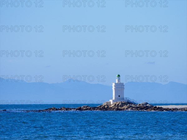 White lighthouse on sea coast