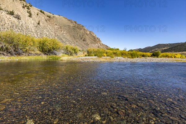 Smooth clear creek in valley