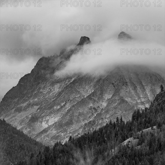 Clouds covering mountain peaks