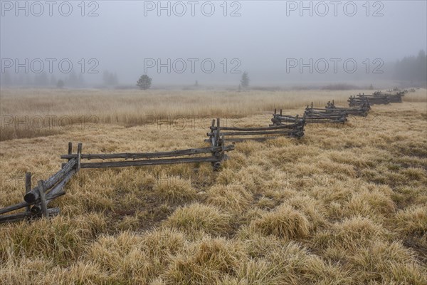 Rail fence in rural scenery at fall