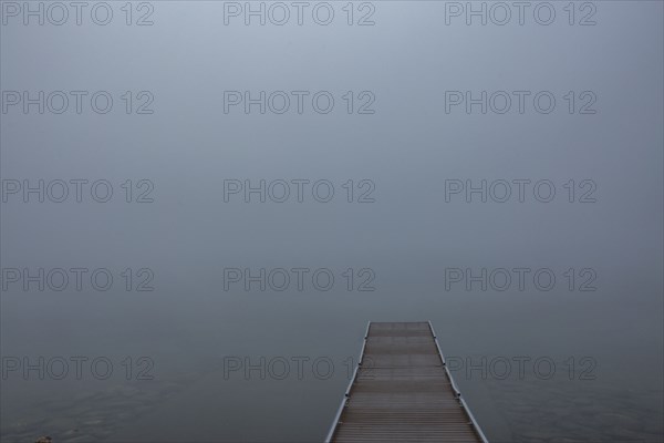 Empty jetty in calm lake