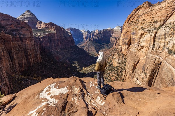 Senior female hiker at overlook of Zion National Park