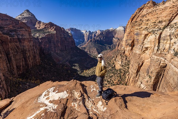 Senior female hiker at overlook of Zion National Park