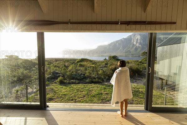 Boy looking at lagoon and Klein mountains