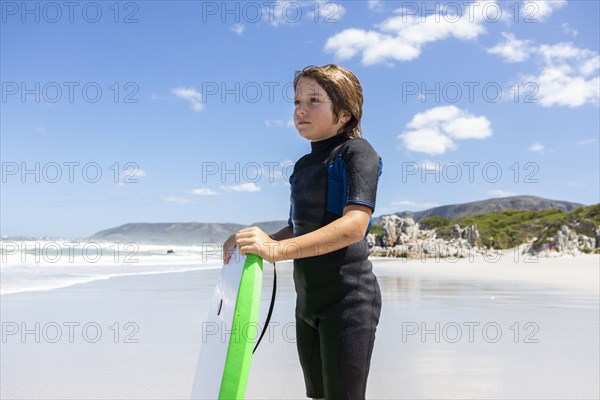 Boy with bodyboard on Grotto Beach