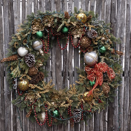 Christmas wreath on wooden fence