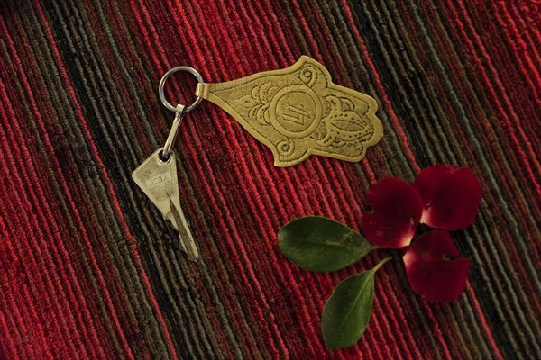 Brass room key and flower