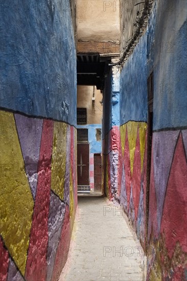 Colorful walls in alleyway in medina