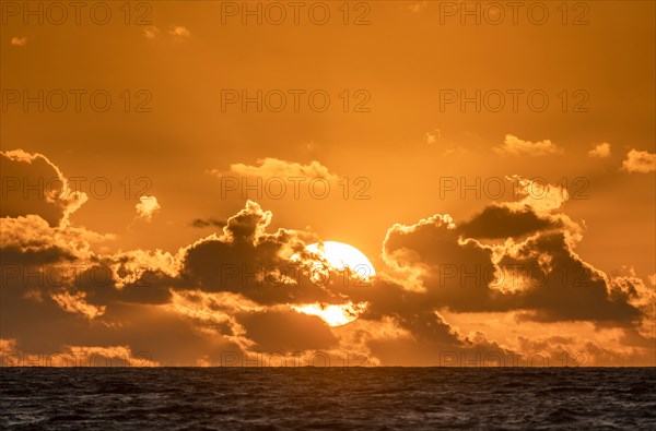 Dramatic sky at sunset over sea