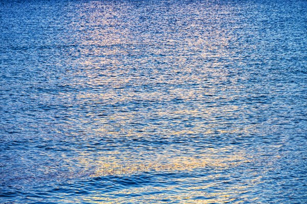 Calm ocean surface reflecting sunlight