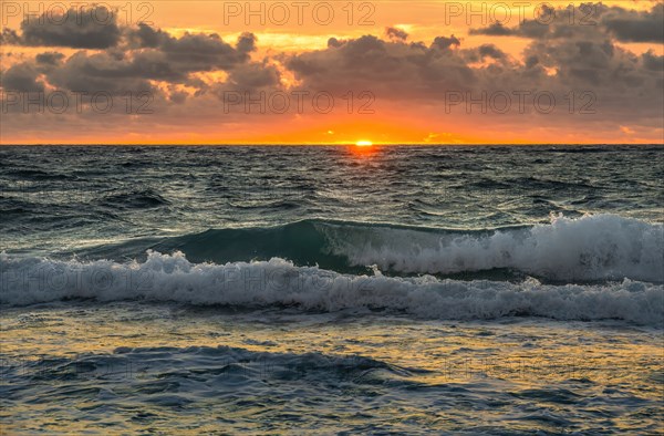 Dramatic sky at sunset over sea