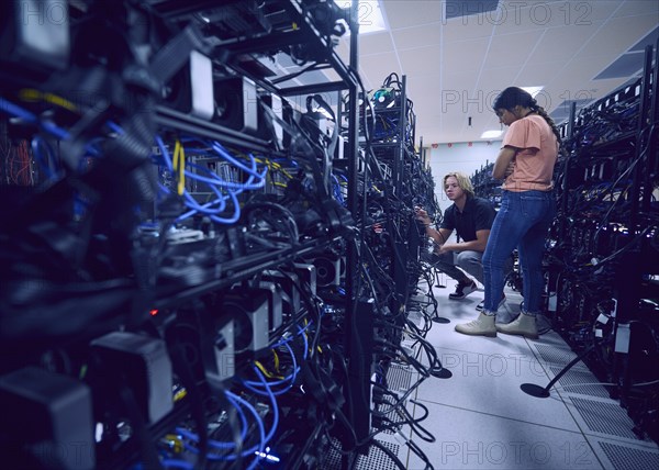 Technicians working in server room