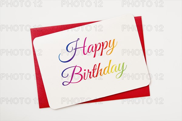 Colorful Happy Birthday card on red envelope