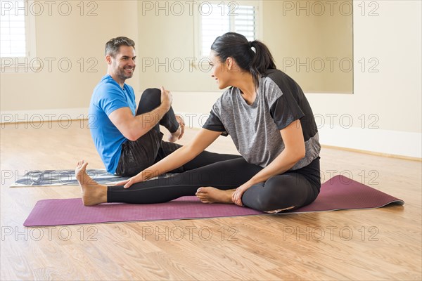 Man and woman stretching together